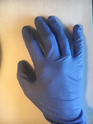 rubber glove on hand